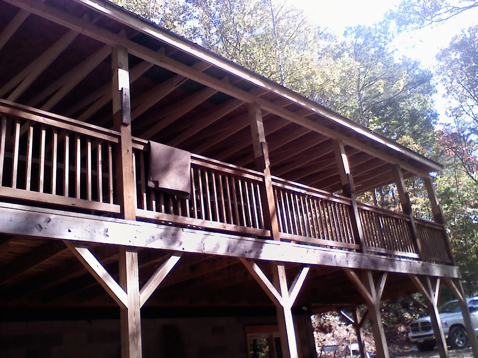 Timber framing under a new elevated porch and deck — Roof Leak Repair in Alberta by Roofing Brothers